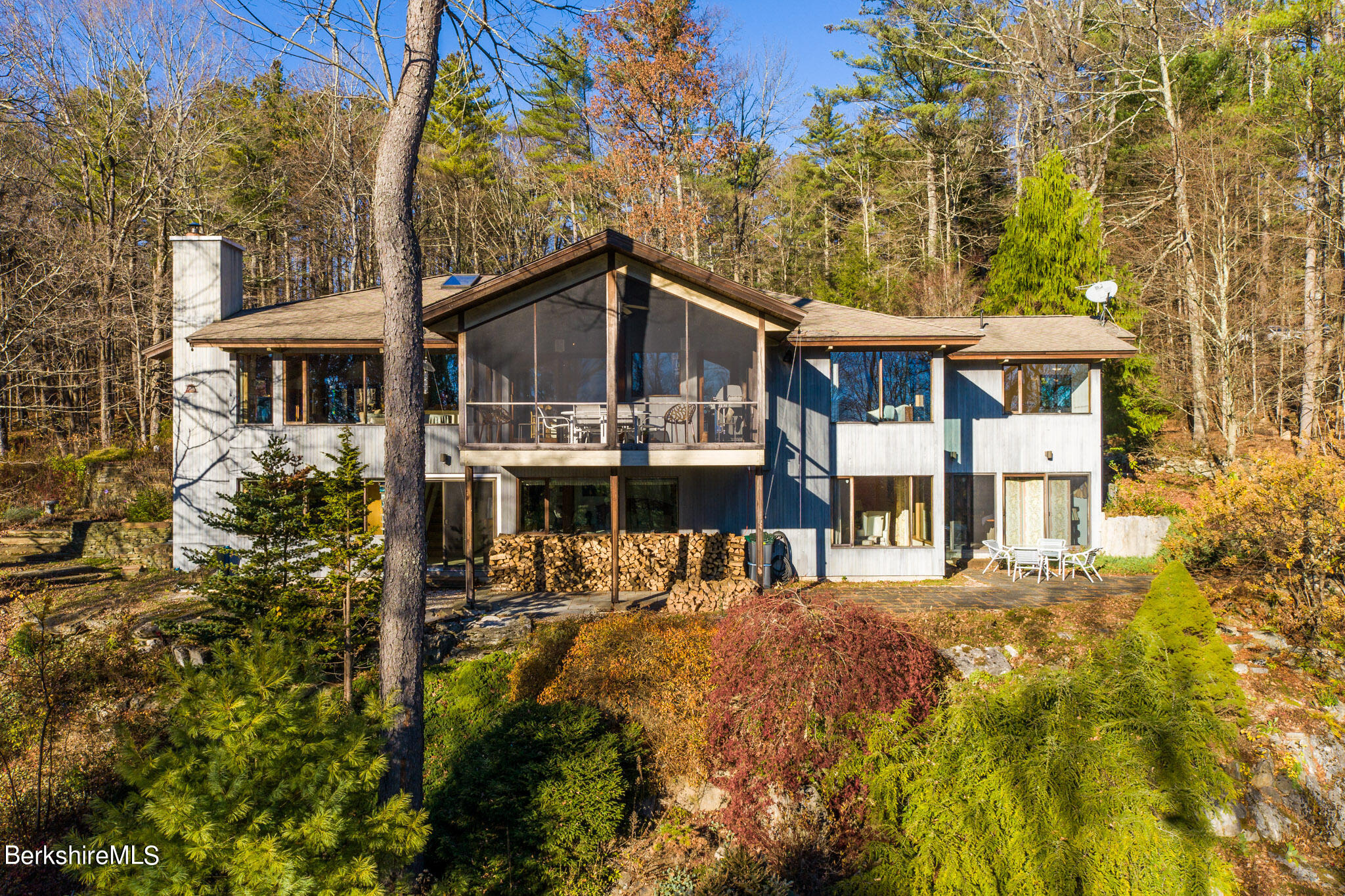140 Main Road Monterey, MA 01230 - Photo 1 of 48 a front view of a house with a yard