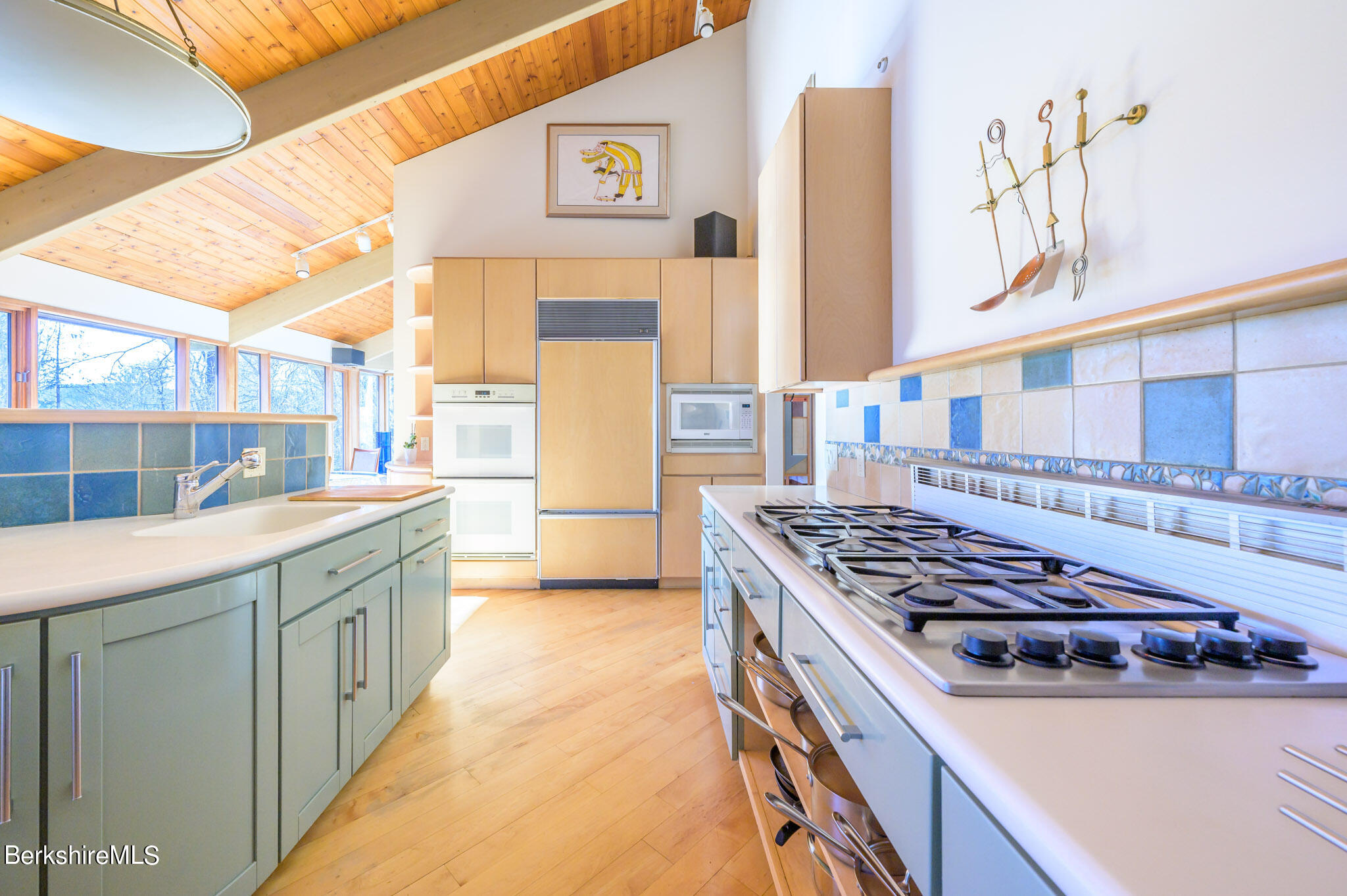 140 Main Road Monterey, MA 01230 - Photo 13 of 48 a kitchen with a sink stove and cabinets