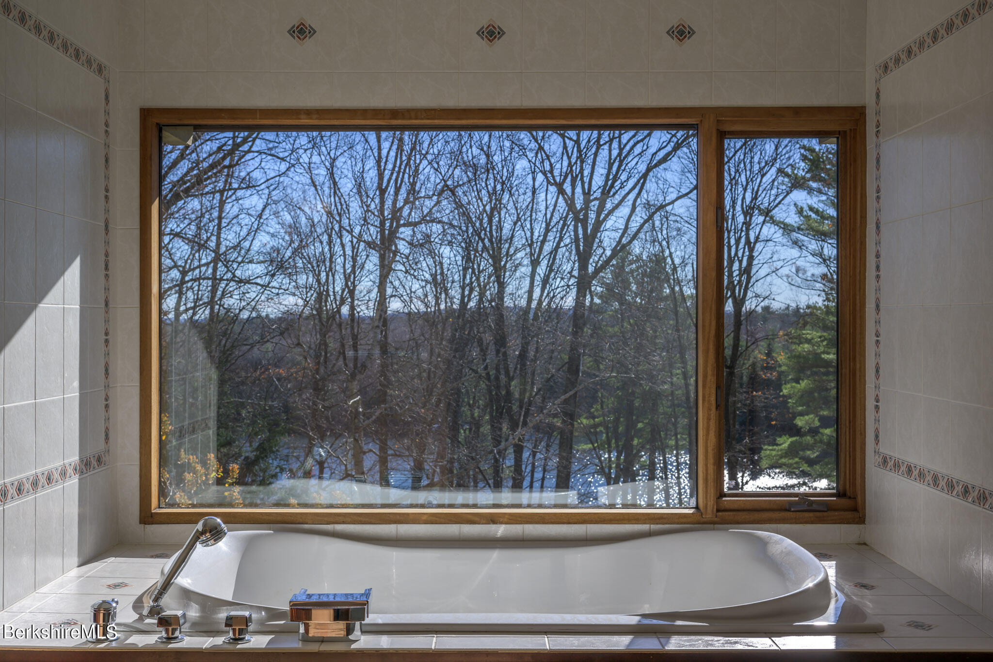 140 Main Road Monterey, MA 01230 - Photo 20 of 48 a view of a bathtub in a room
