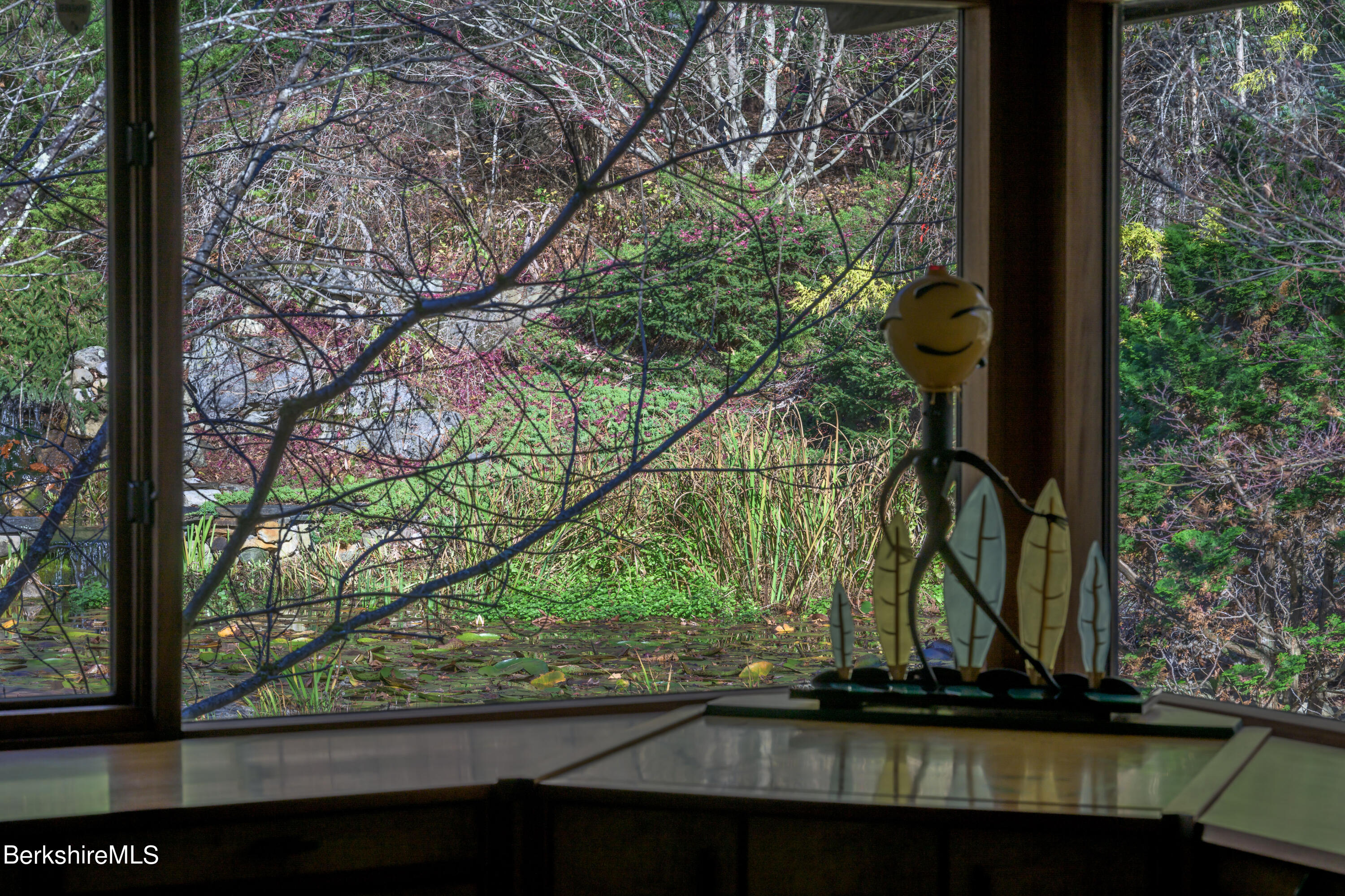 140 Main Road Monterey, MA 01230 - Photo 23 of 48 a view of a tree in front of a wooden house