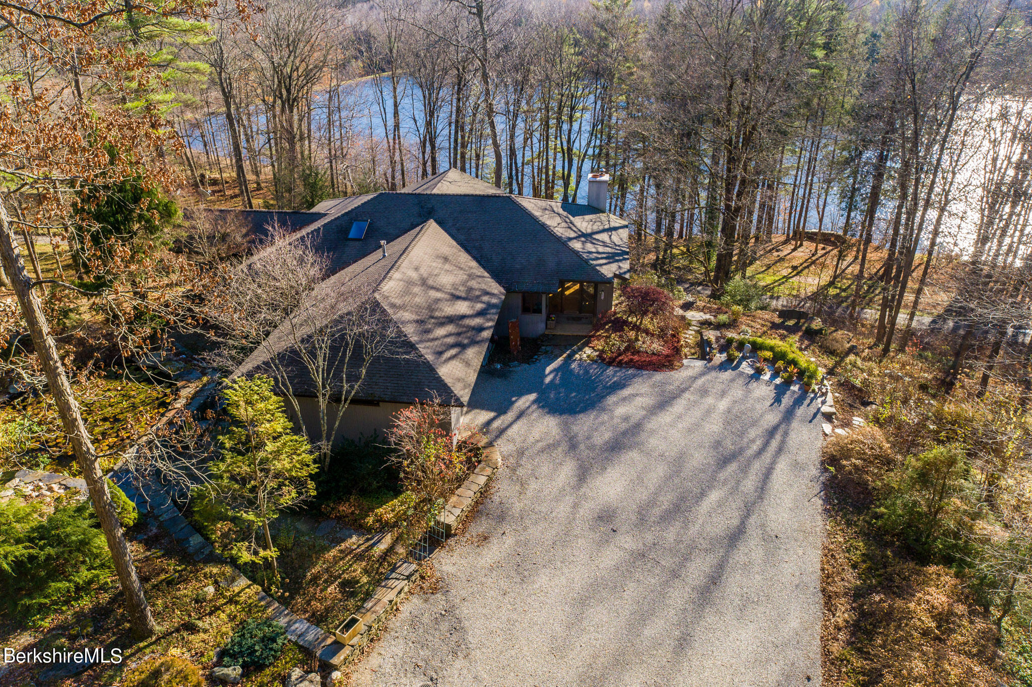 140 Main Road Monterey, MA 01230 - Photo 3 of 48 a view of a backyard with sitting area and covered with snow