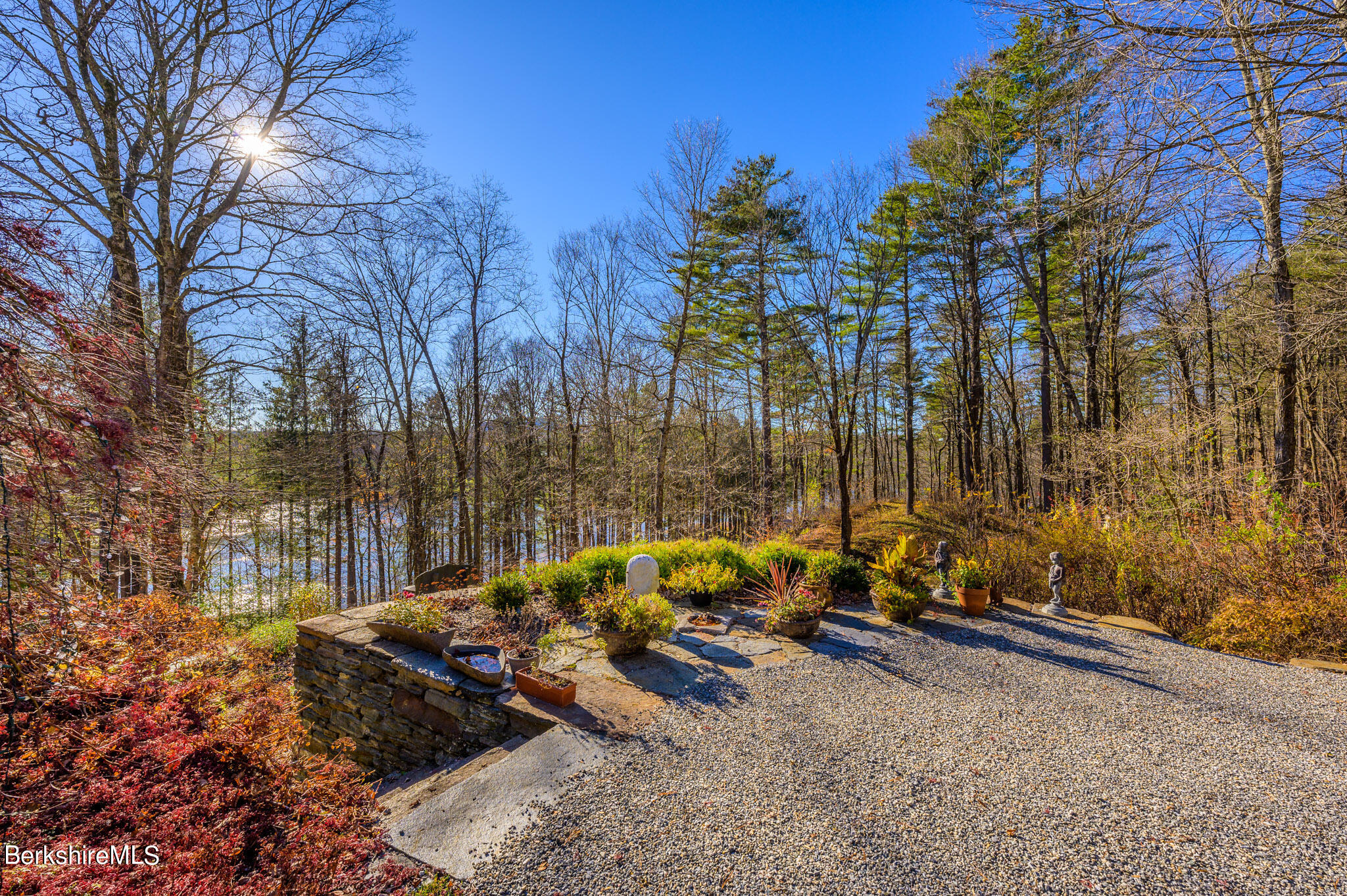 140 Main Road Monterey, MA 01230 - Photo 46 of 48 a backyard of a house with outdoor seating