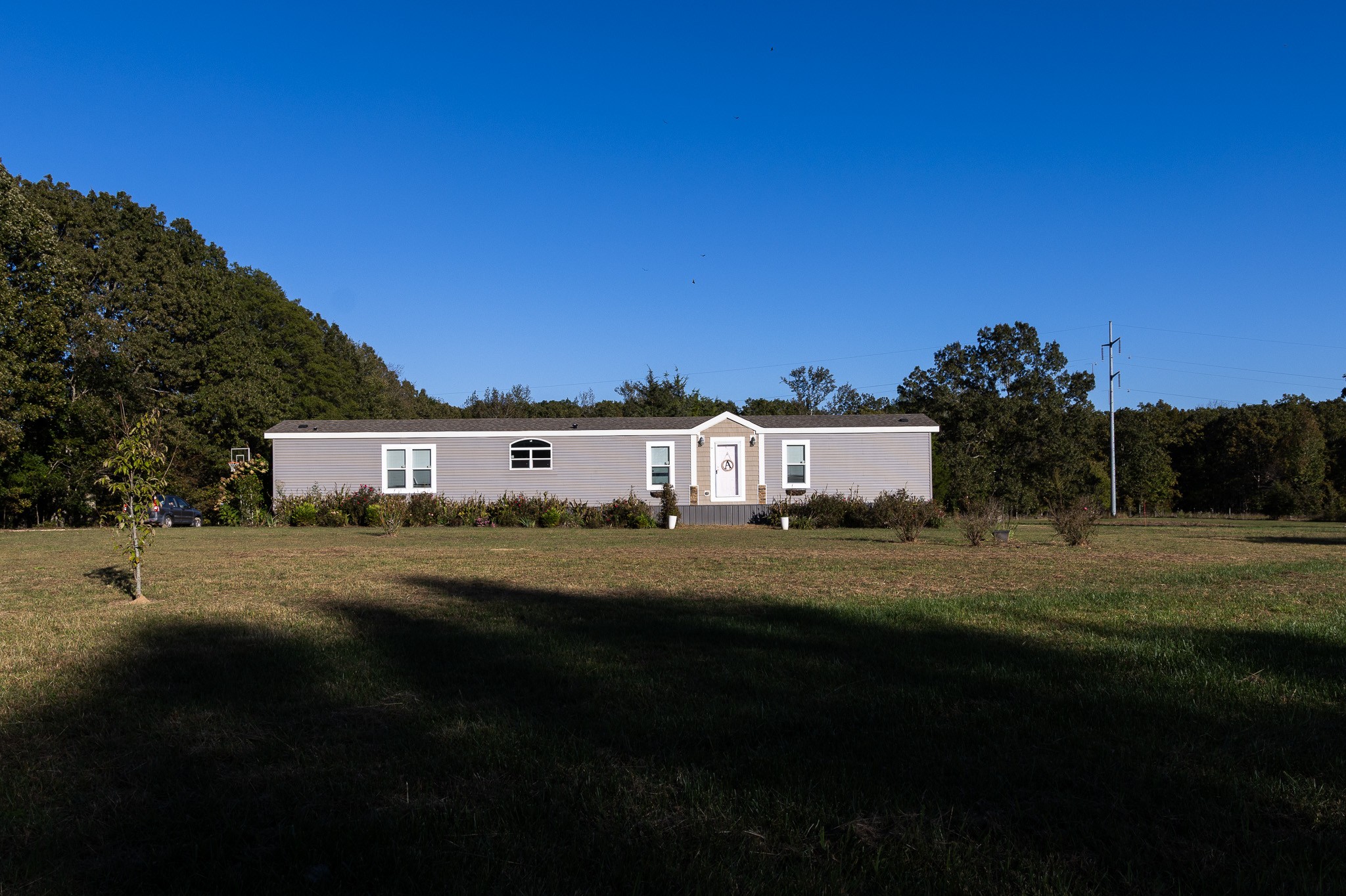 a view of a big house with a big yard
