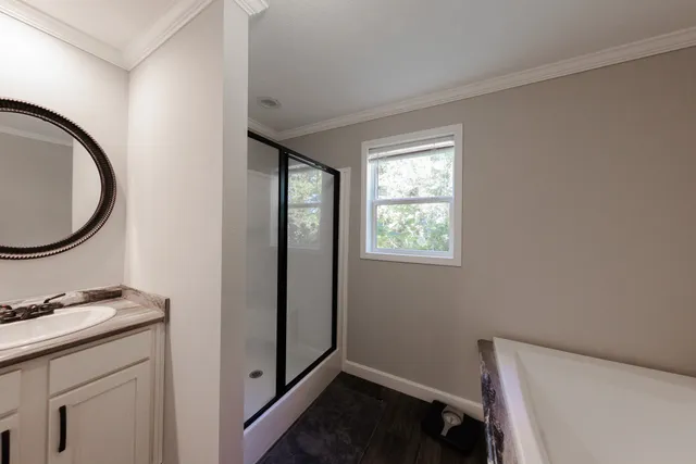 a view of a room with rack and a dresser