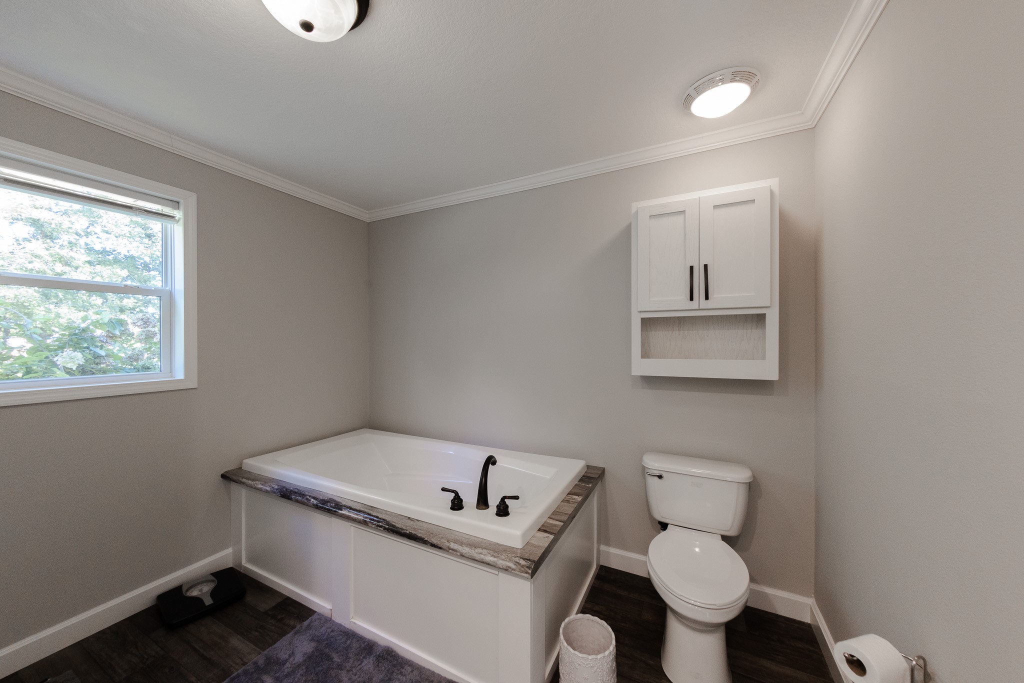 307 Swiss Colony Road Hohenwald, TN 38462 - Photo 12 of 35 a white toilet sitting next to a bathroom sink