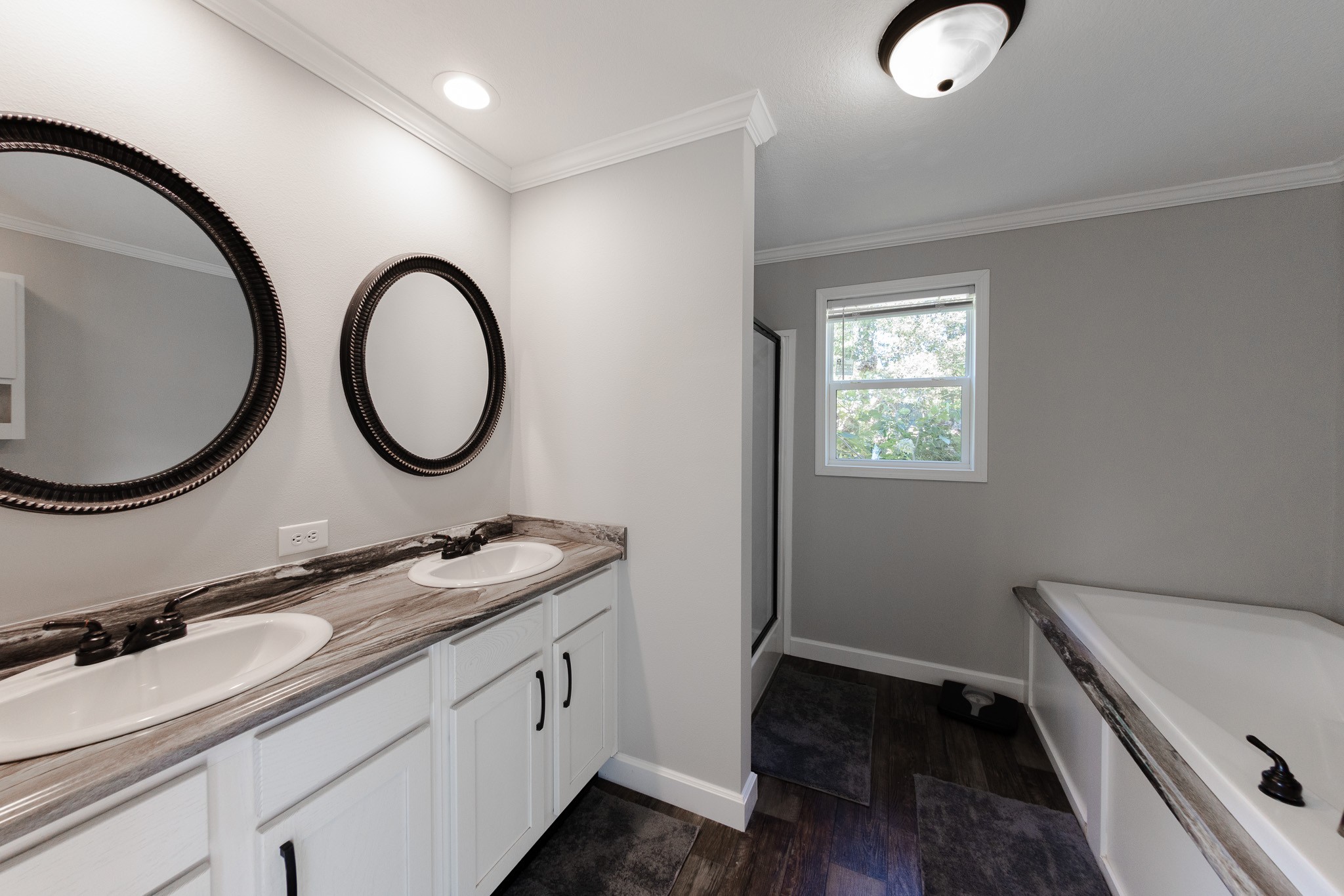 307 Swiss Colony Road Hohenwald, TN 38462 - Photo 13 of 35 a bathroom with a granite countertop double vanity sink and a mirror