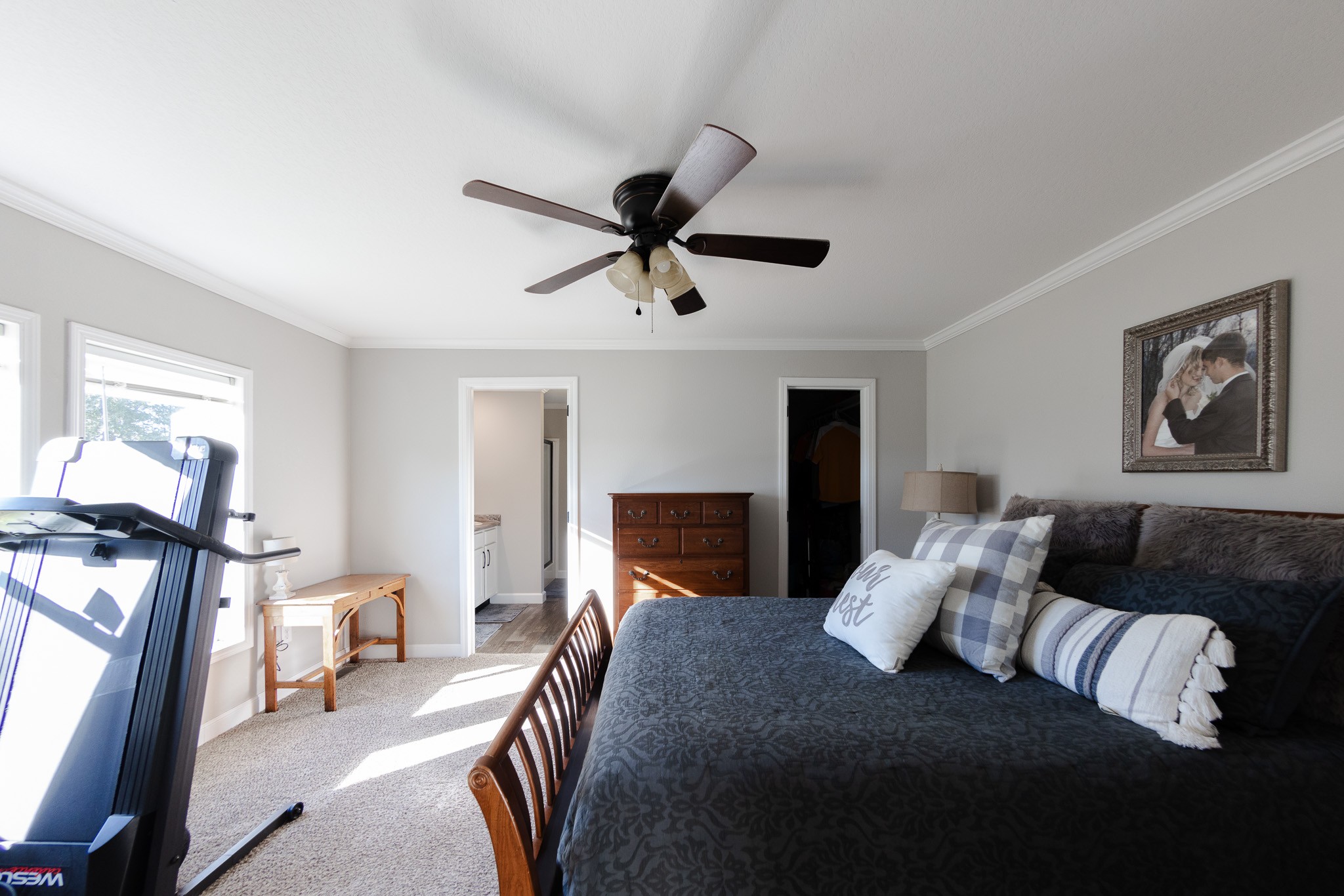 307 Swiss Colony Road Hohenwald, TN 38462 - Photo 14 of 35 a bedroom with a bed and a chandelier