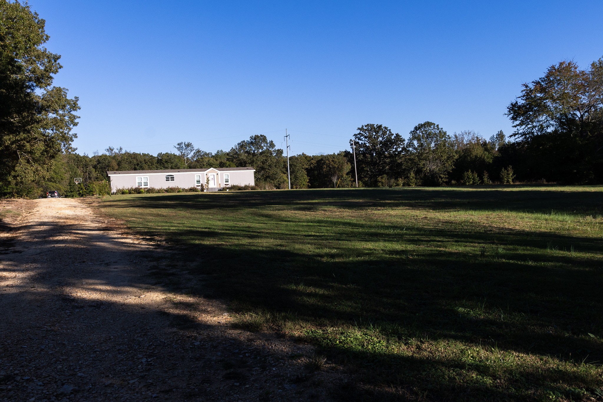 307 Swiss Colony Road Hohenwald, TN 38462 - Photo 31 of 35 a view of a lake from a yard