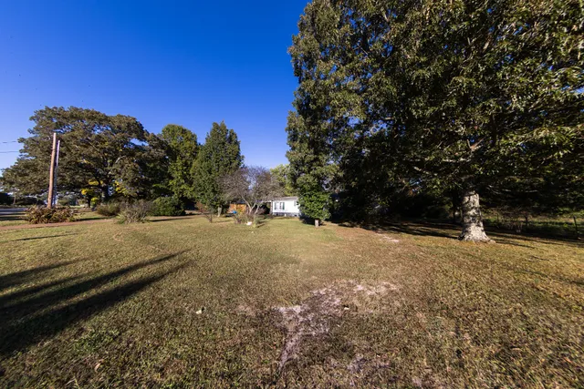 a view of a house with backyard porch and sitting area