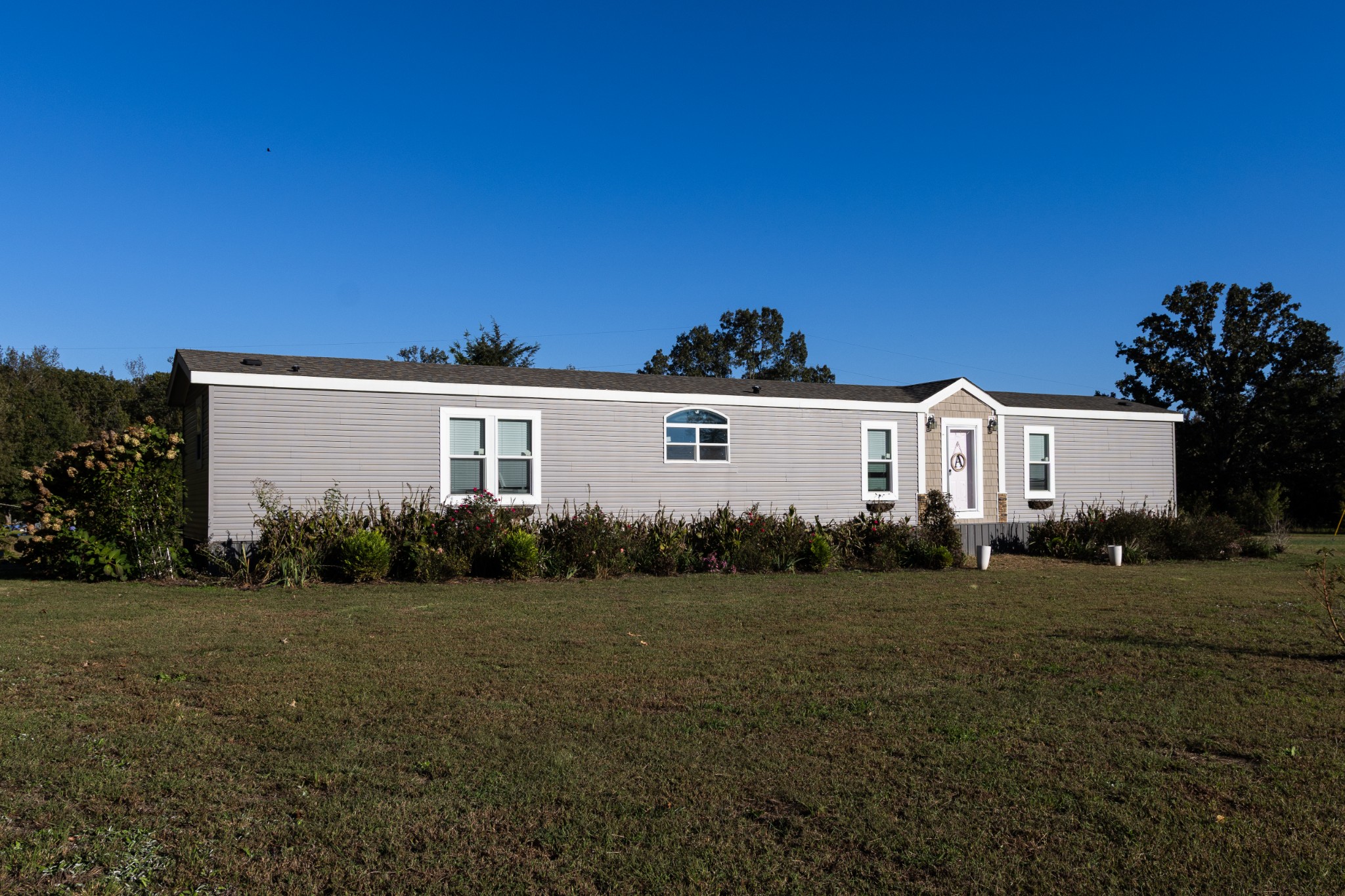 307 Swiss Colony Road Hohenwald, TN 38462 - Photo 5 of 35 front view of a house with a yard