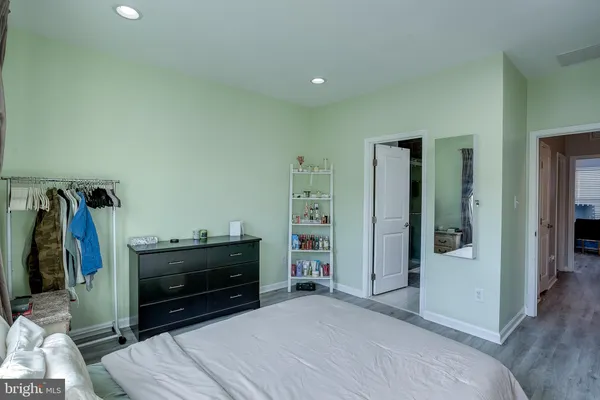 a bedroom with furniture and a fireplace