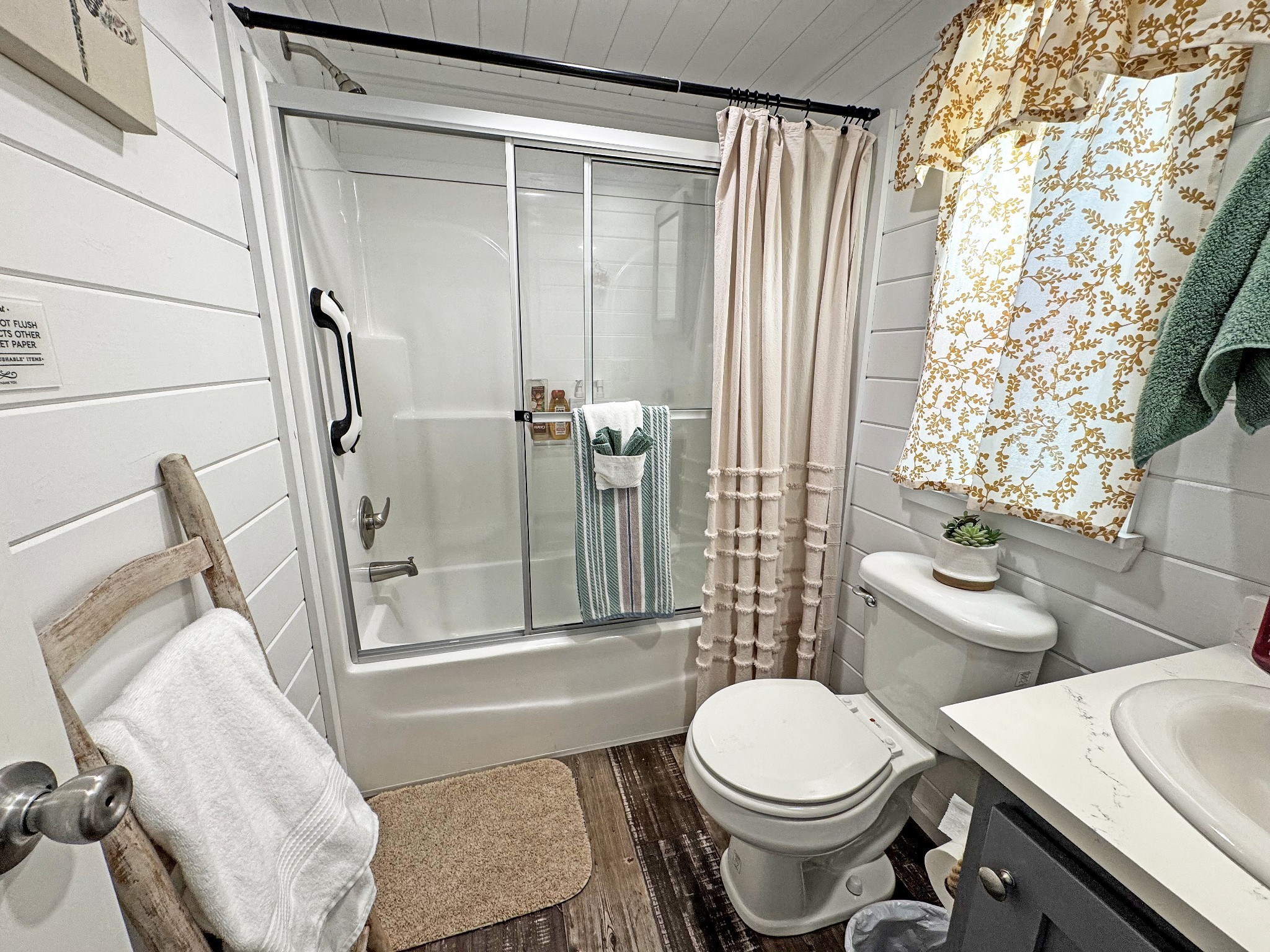 103 Thomas Road Dover, TN 37058 - Photo 13 of 16 a white toilet sitting next to a bathroom sink