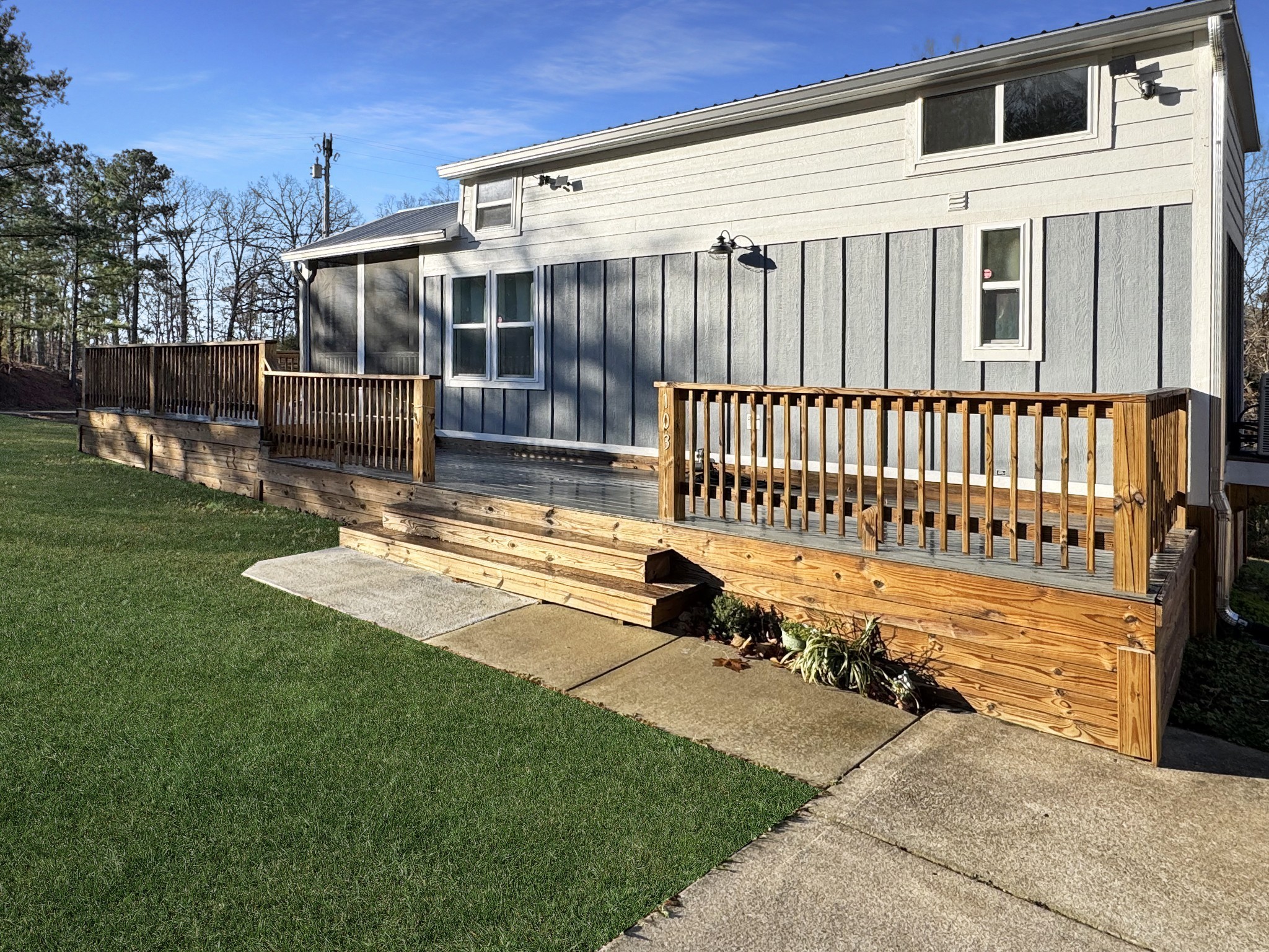 103 Thomas Road Dover, TN 37058 - Photo 3 of 16 a view of a backyard with wooden fence