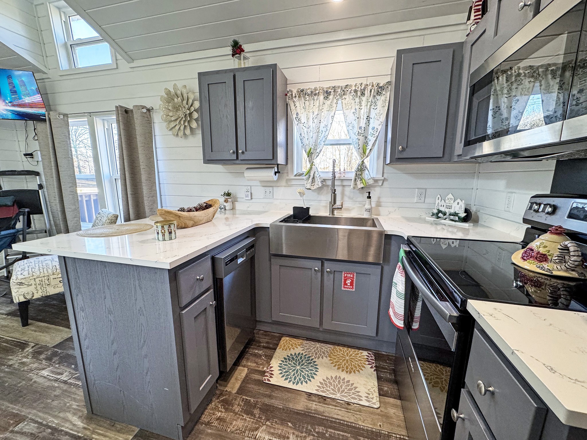 103 Thomas Road Dover, TN 37058 - Photo 9 of 16 a kitchen with stainless steel appliances granite countertop a sink stove and refrigerator