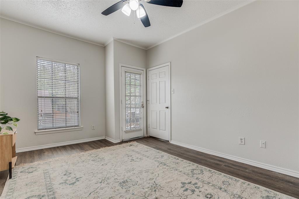 6003 Oram Street, Unit 107 Dallas, TX 75206 - Photo 12 of 23 an empty room with windows