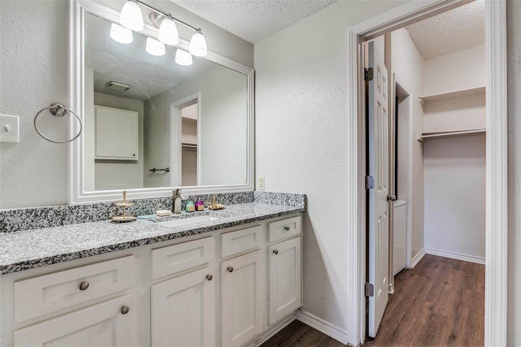 6003 Oram Street, Unit 107 Dallas, TX 75206 - Photo 16 of 23 a bathroom with a granite countertop sink double and mirror