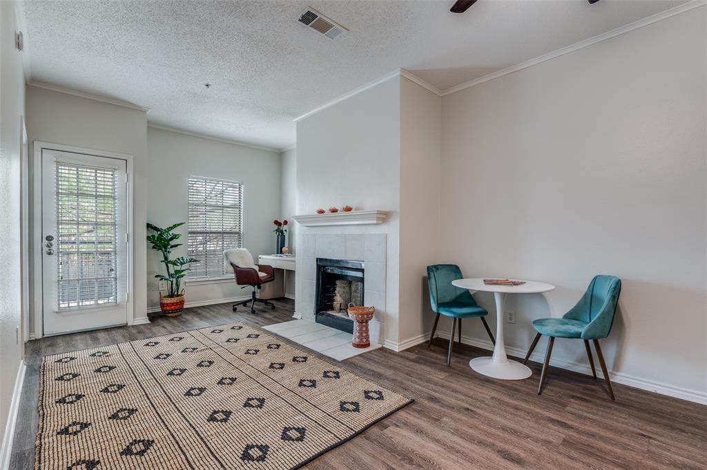 6003 Oram Street, Unit 107 Dallas, TX 75206 - Photo 2 of 23 a living room with furniture and a fireplace