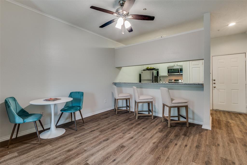 6003 Oram Street, Unit 107 Dallas, TX 75206 - Photo 4 of 23 a view of a dining room with furniture and wooden floor