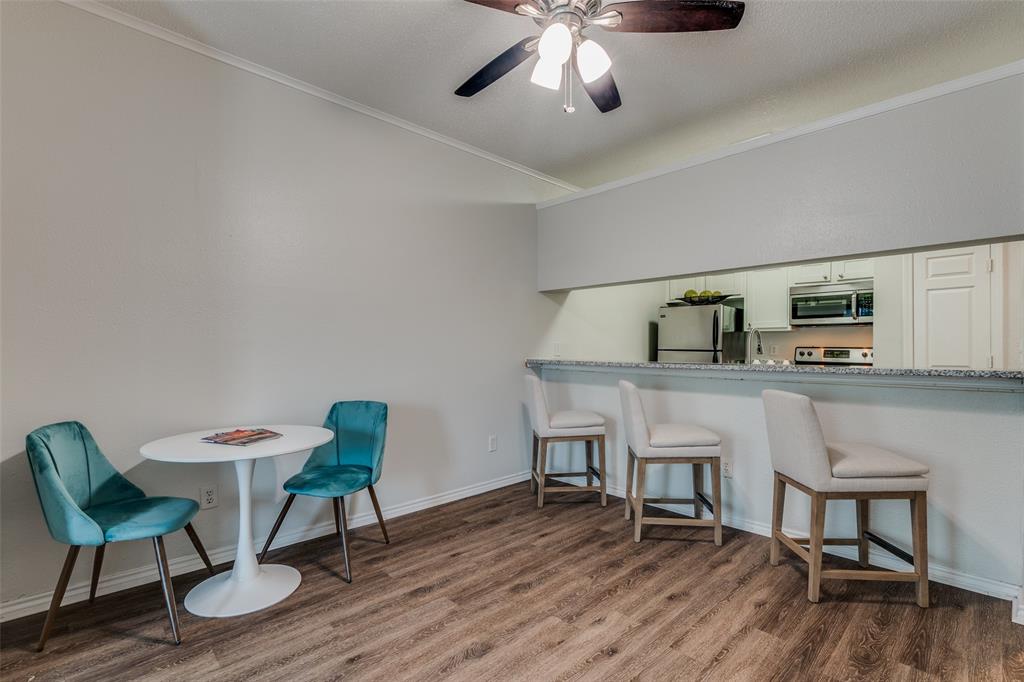 6003 Oram Street, Unit 107 Dallas, TX 75206 - Photo 5 of 23 a living room with furniture and a wooden floor