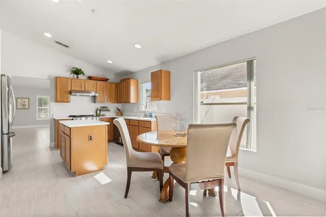a view of kitchen with cabinets and wooden floor