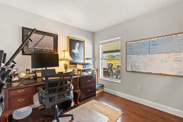 a bedroom with a bed and a potted plant