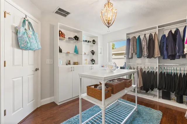 a bathroom with a sink a mirror and a shower