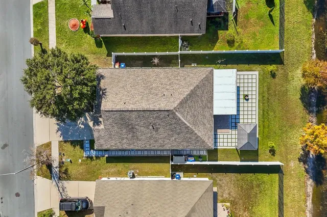 an aerial view of residential houses with outdoor space