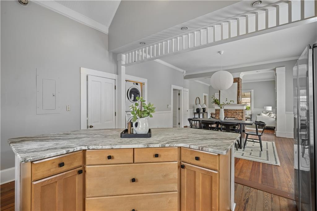 2891 Macaw Street Northwest Atlanta, GA 30318 - Photo 13 of 26 a view of living room with granite countertop cabinets and couches