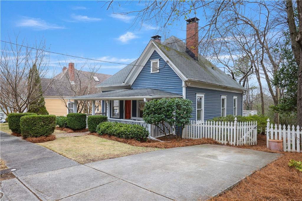 2891 Macaw Street Northwest Atlanta, GA 30318 - Photo 26 of 26 a front view of a house with a garden