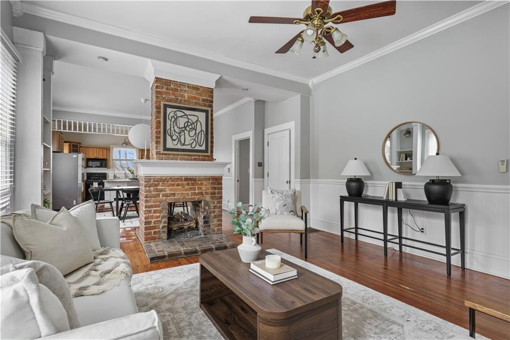 2891 Macaw Street Northwest Atlanta, GA 30318 - Photo 4 of 26 a living room with furniture a fireplace and decor