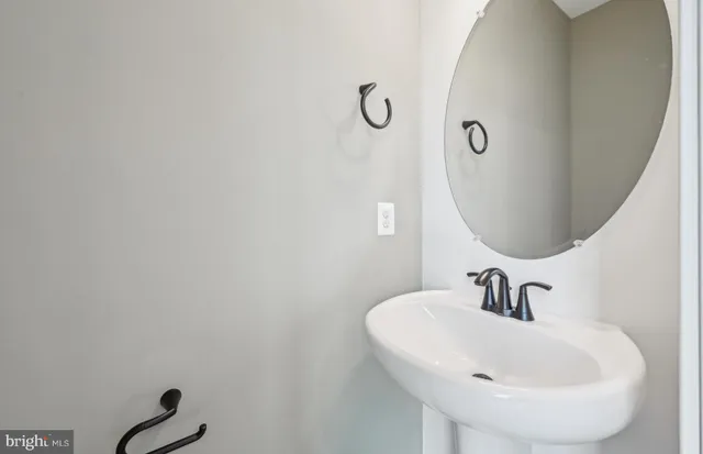 a large bed sitting in a bedroom next to a window