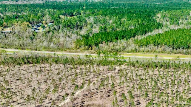 a view of a lake with a yard