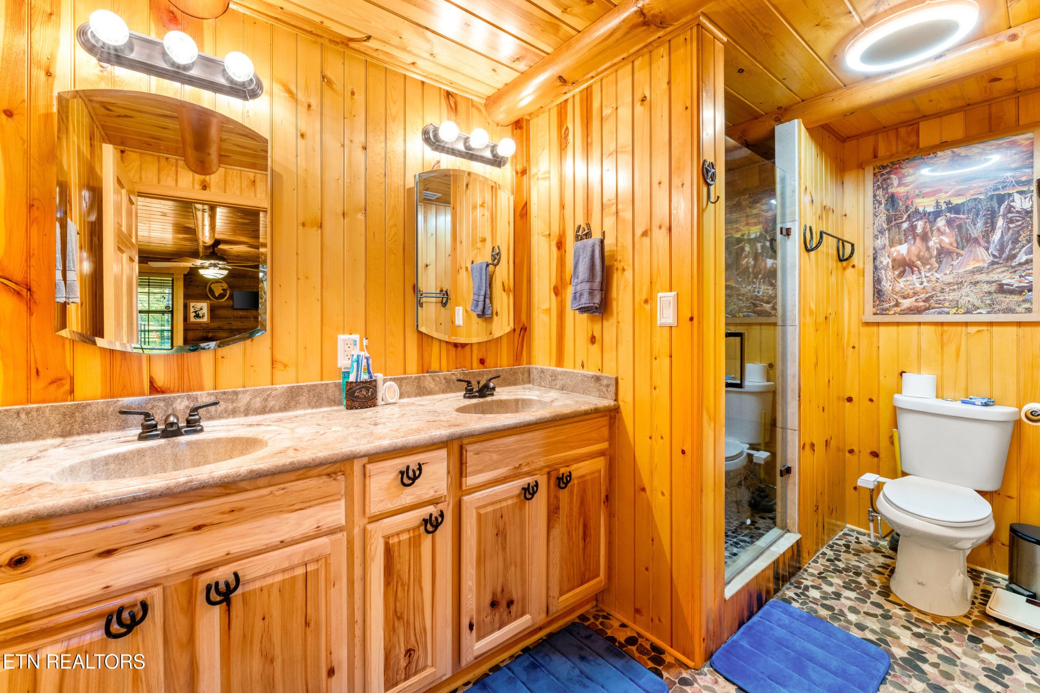 228 Pattie Gap Road Philadelphia, TN 37846 - Photo 20 of 57 a spacious bathroom with a double vanity sink toilet and a shower