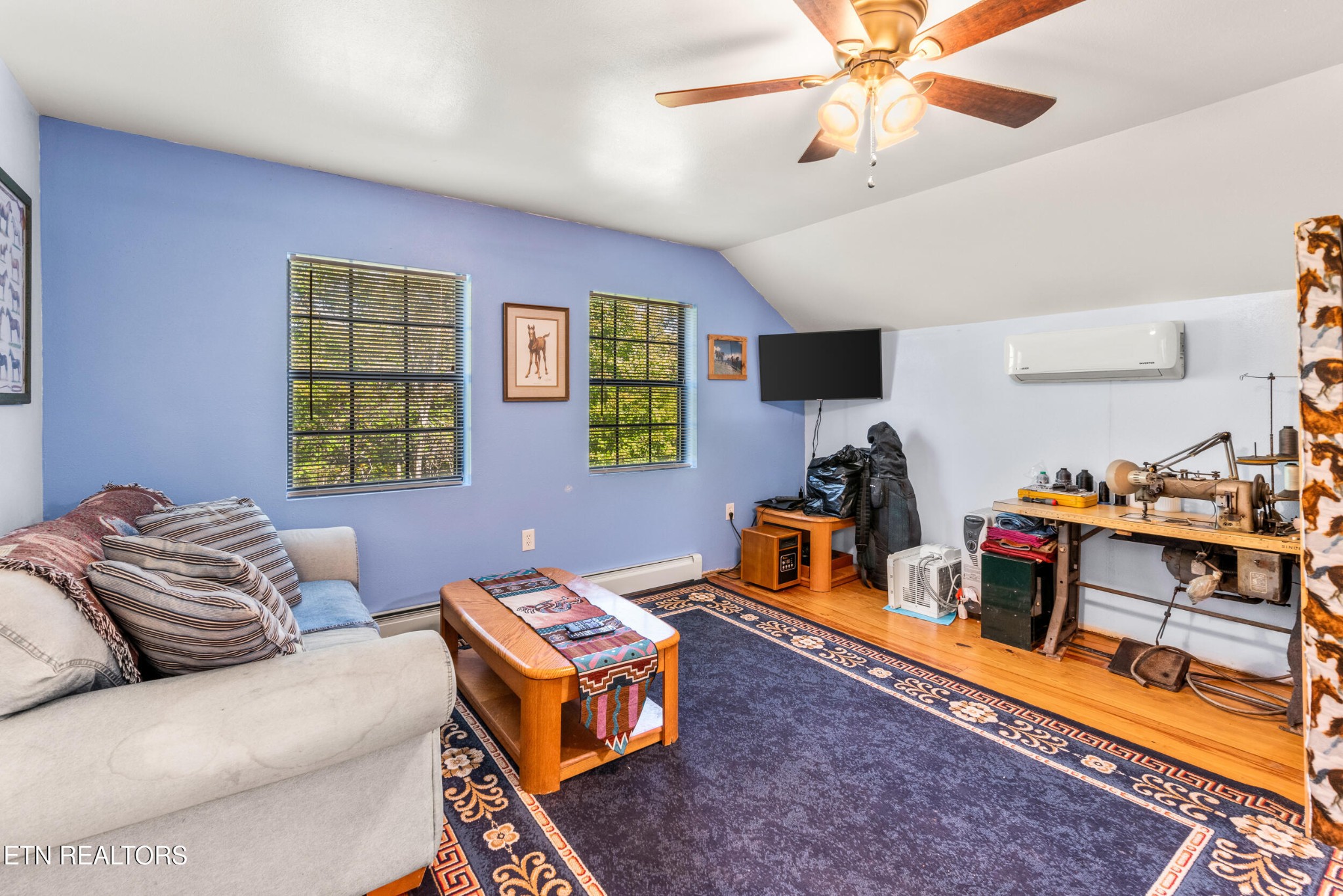 228 Pattie Gap Road Philadelphia, TN 37846 - Photo 37 of 57 a living room with furniture and a wooden floor