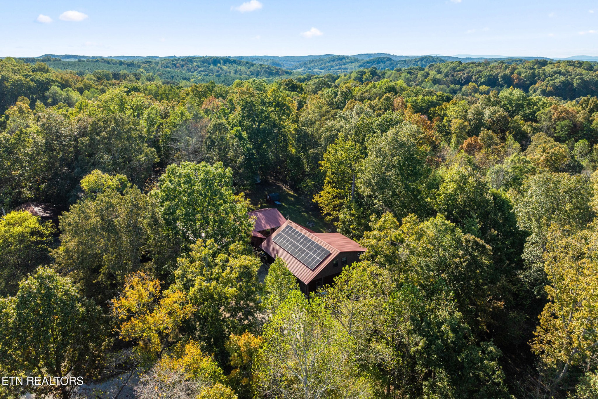 228 Pattie Gap Road Philadelphia, TN 37846 - Photo 54 of 57 a view of a yard with an outdoor space and seating area