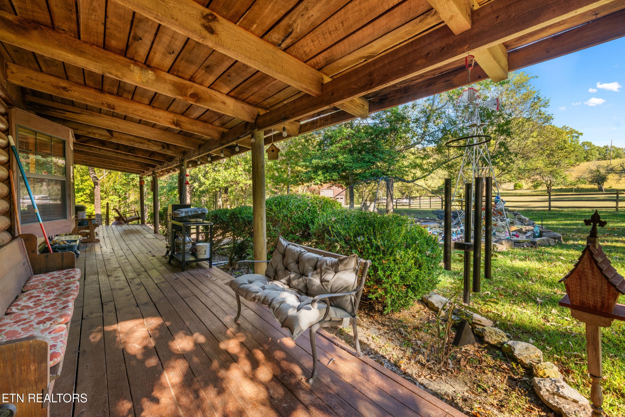 228 Pattie Gap Road Philadelphia, TN 37846 - Photo 6 of 57 a view of a patio with table and chairs potted plants with wooden floor and fence