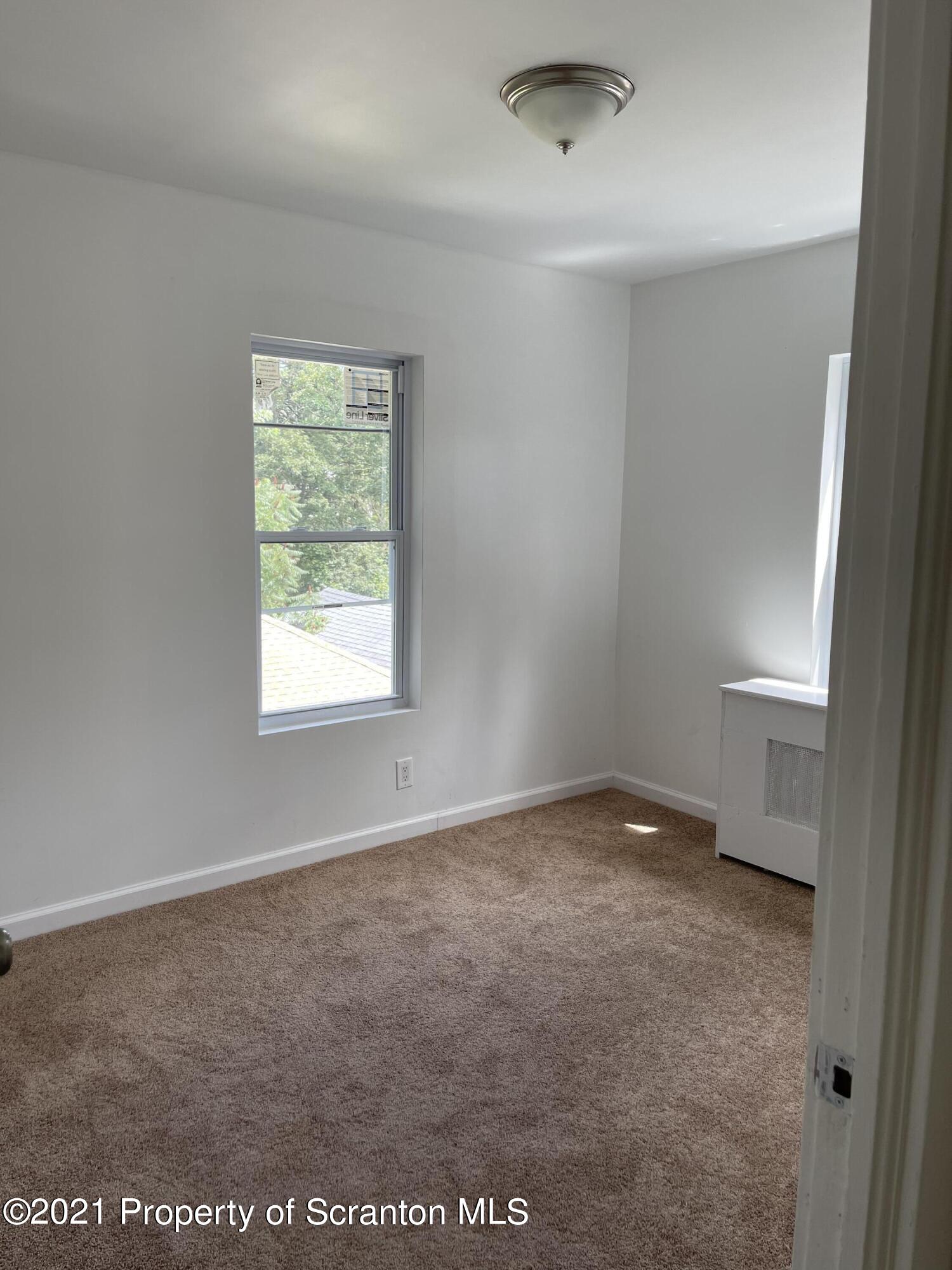 9 Front Street Clarks Summit, PA 18411 - Photo 16 of 22 an empty room with a window