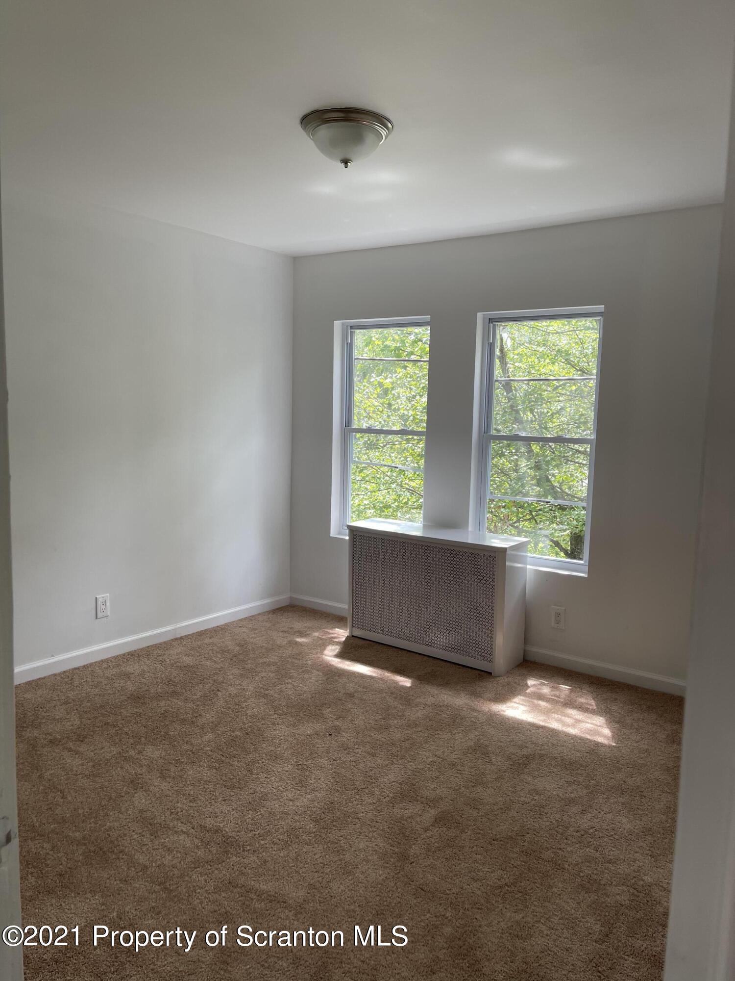 9 Front Street Clarks Summit, PA 18411 - Photo 17 of 22 an empty room with windows