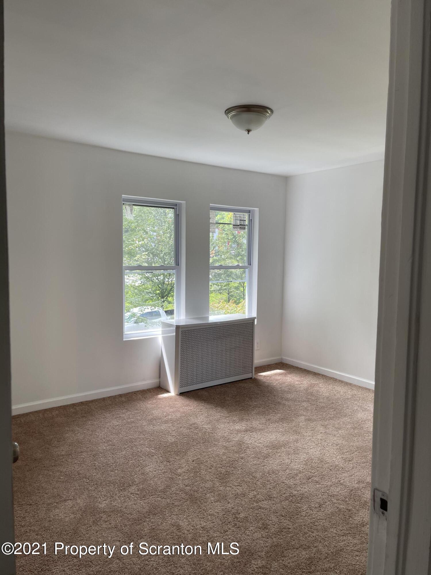 9 Front Street Clarks Summit, PA 18411 - Photo 18 of 22 an empty room with windows