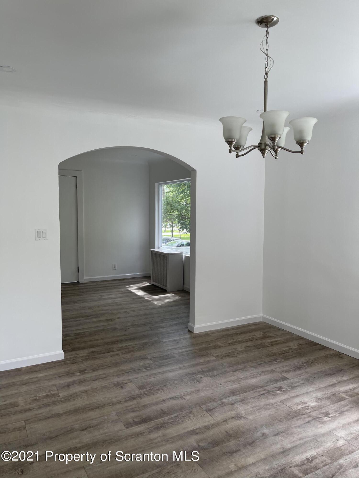 9 Front Street Clarks Summit, PA 18411 - Photo 9 of 22 a view of empty room with wooden floor and window