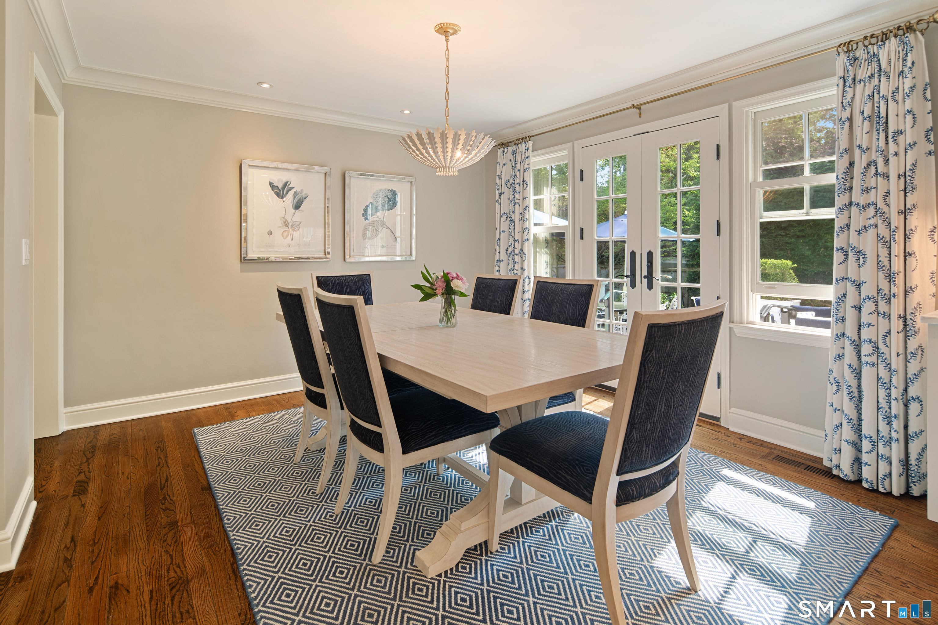 11 McLaren Road South Darien, CT 06820 - Photo 15 of 40 a view of a dining room with furniture wooden floor and chandelier