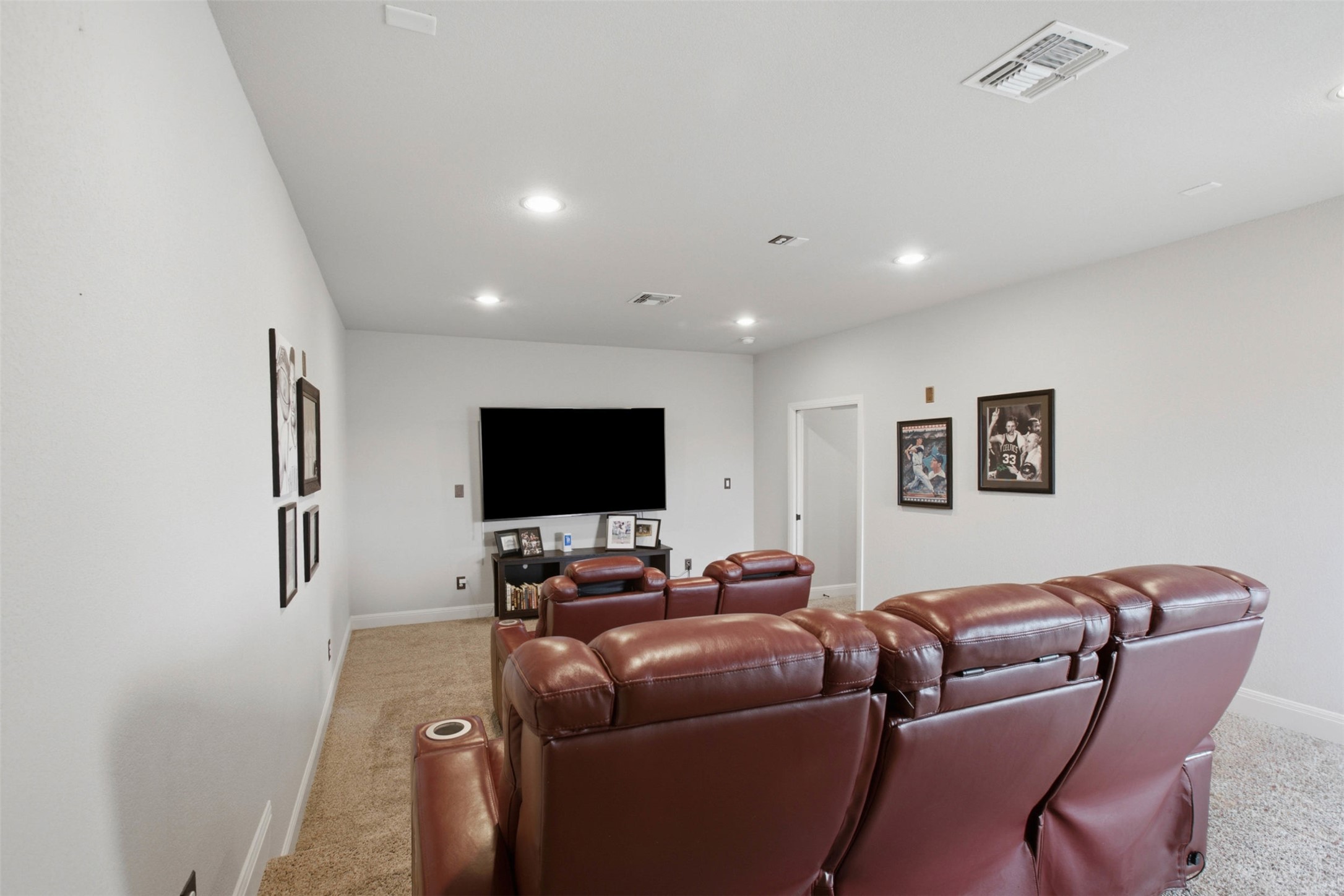 1113 Modoc Way Kyle, TX 78640 - Photo 26 of 34 A dedicated media room offers comfortable stadium seating and ambient recessed lighting for optimal viewing.