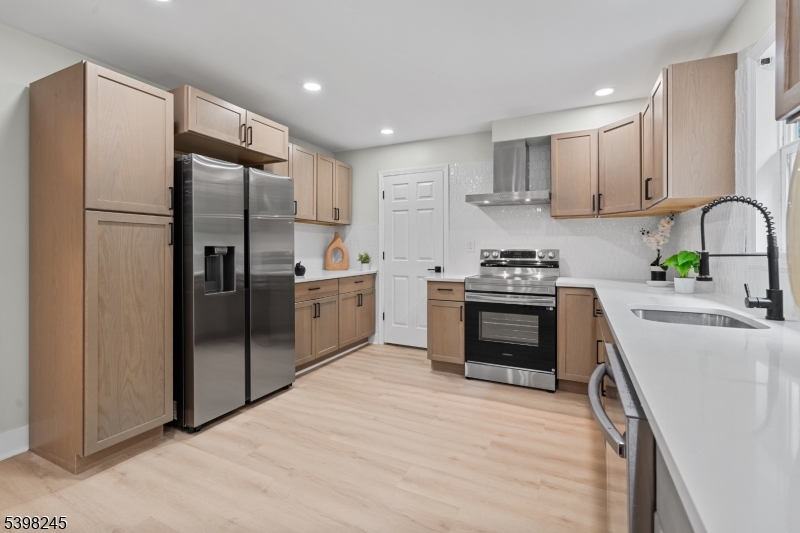 51 Pidgeon Hill Road Wantage, NJ 07461 - Photo 11 of 39 a kitchen with stainless steel appliances granite countertop a refrigerator sink and stove