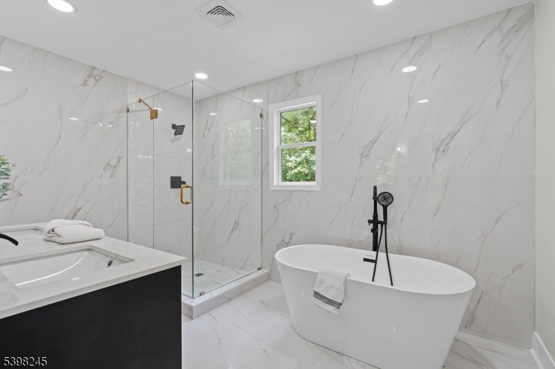 51 Pidgeon Hill Road Wantage, NJ 07461 - Photo 18 of 39 a bathroom with a bathtub and a sink