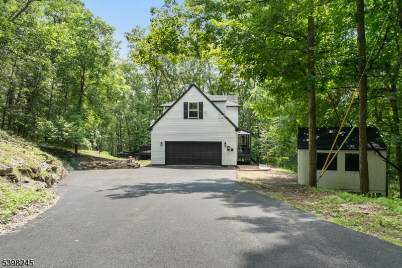 51 Pidgeon Hill Road Wantage, NJ 07461 - Photo 33 of 39 a front view of a house with a garage