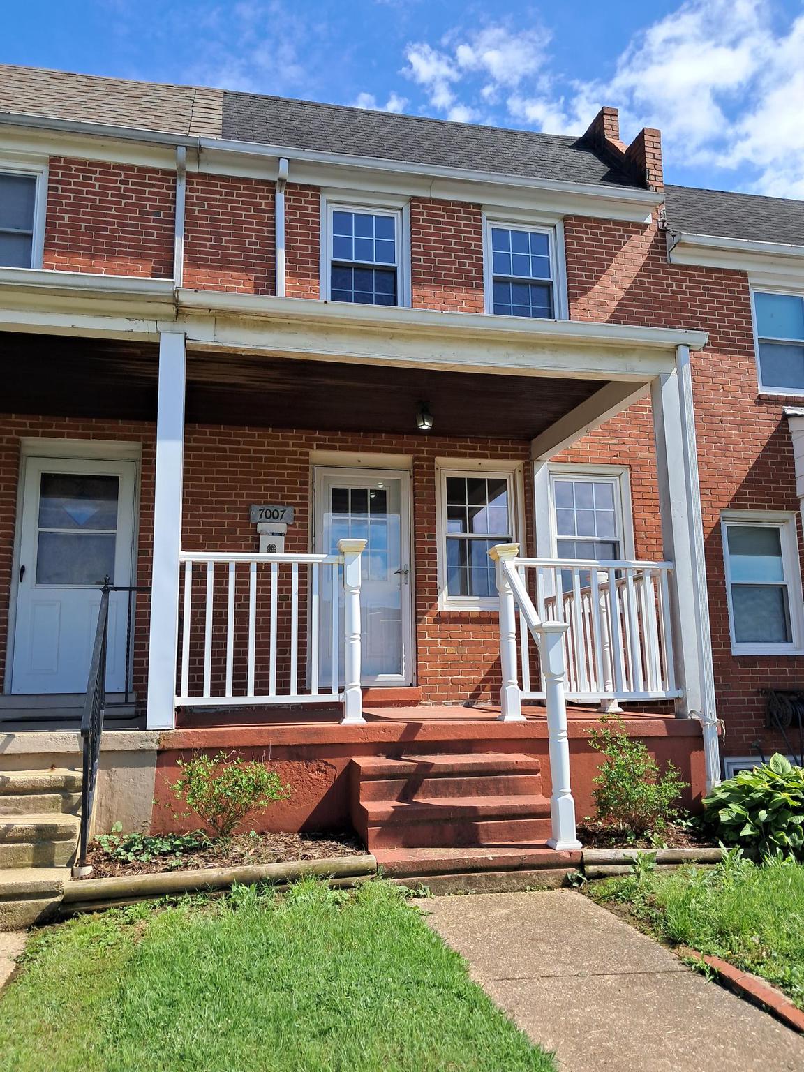 7007 Bank Street Baltimore, MD 21224 - Photo 1 of 17 front view of a house with a yard