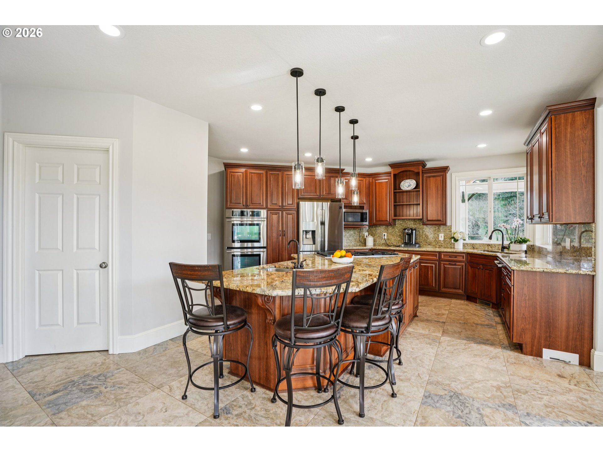 23044 Southwest Ulsky Road West Linn, OR 97068 - Photo 12 of 48 a dining hall with stainless steel appliances a dining table and chairs