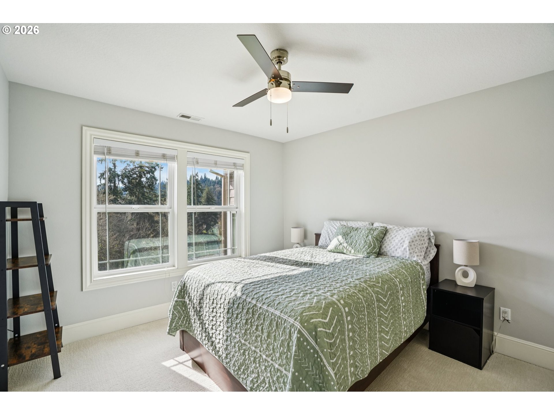 23044 Southwest Ulsky Road West Linn, OR 97068 - Photo 17 of 48 a bedroom with a bed and a large window