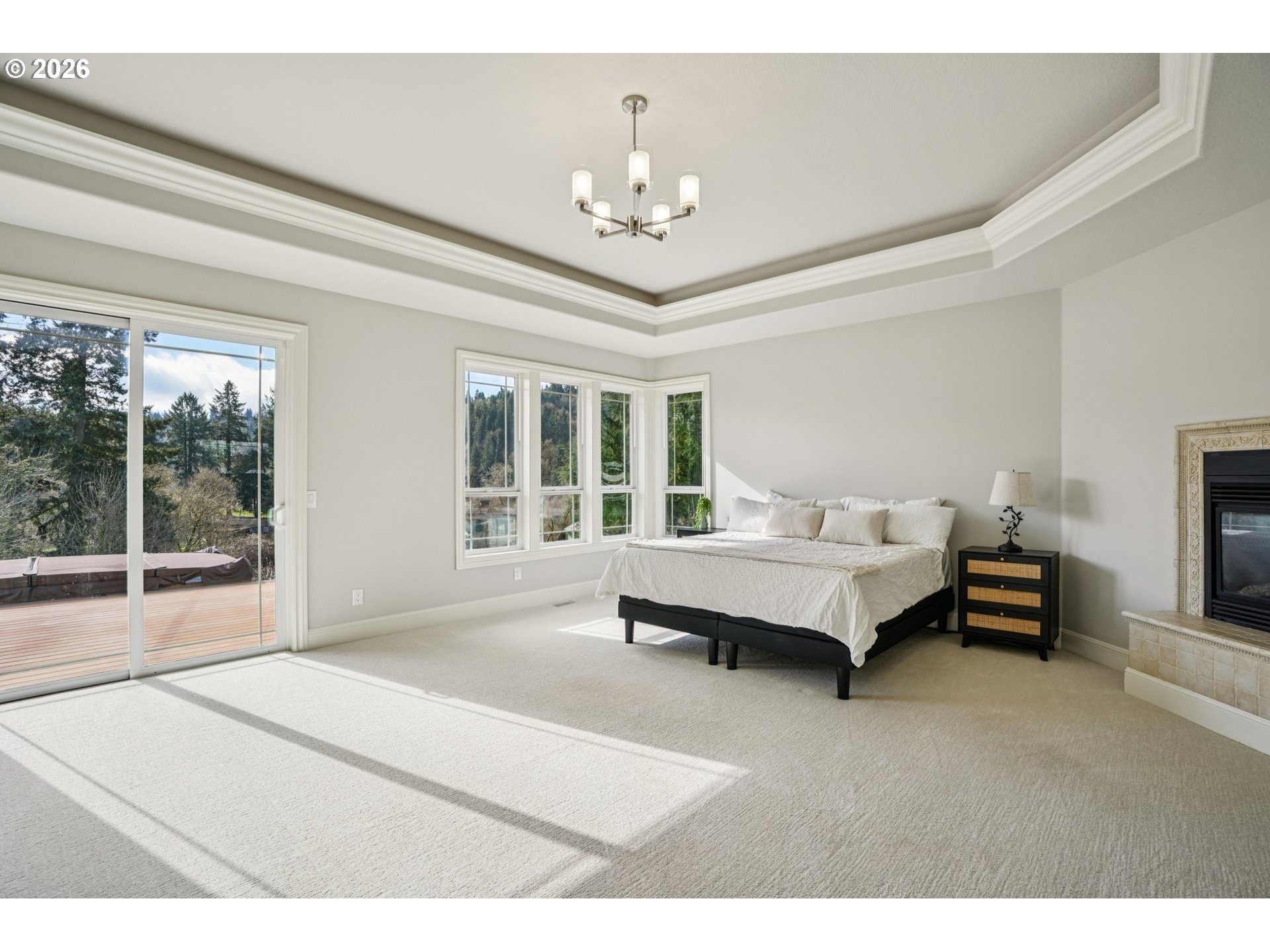 23044 Southwest Ulsky Road West Linn, OR 97068 - Photo 21 of 48 a spacious bedroom with a bed and a large window