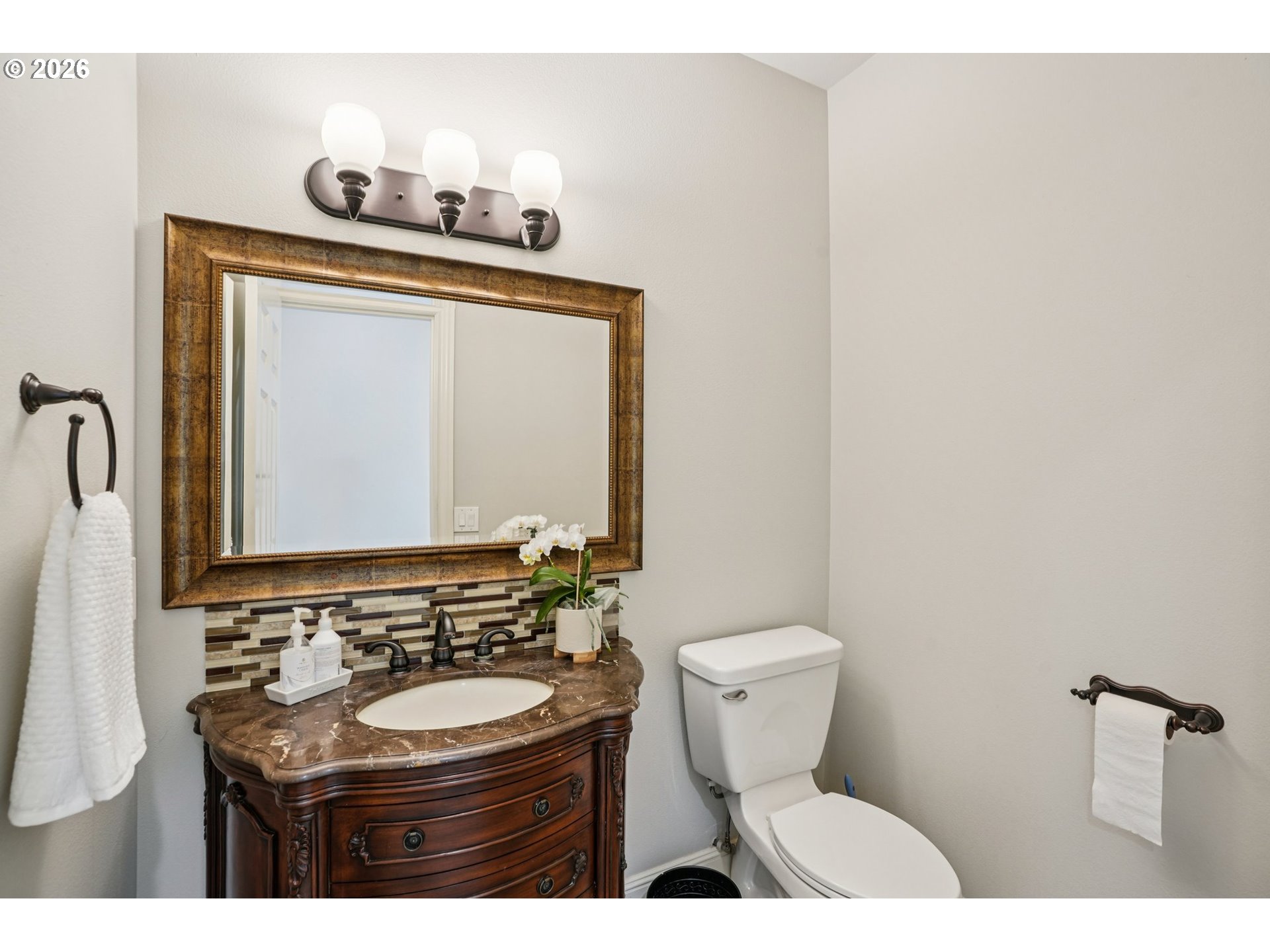 23044 Southwest Ulsky Road West Linn, OR 97068 - Photo 29 of 48 a bathroom with a toilet sink and mirror